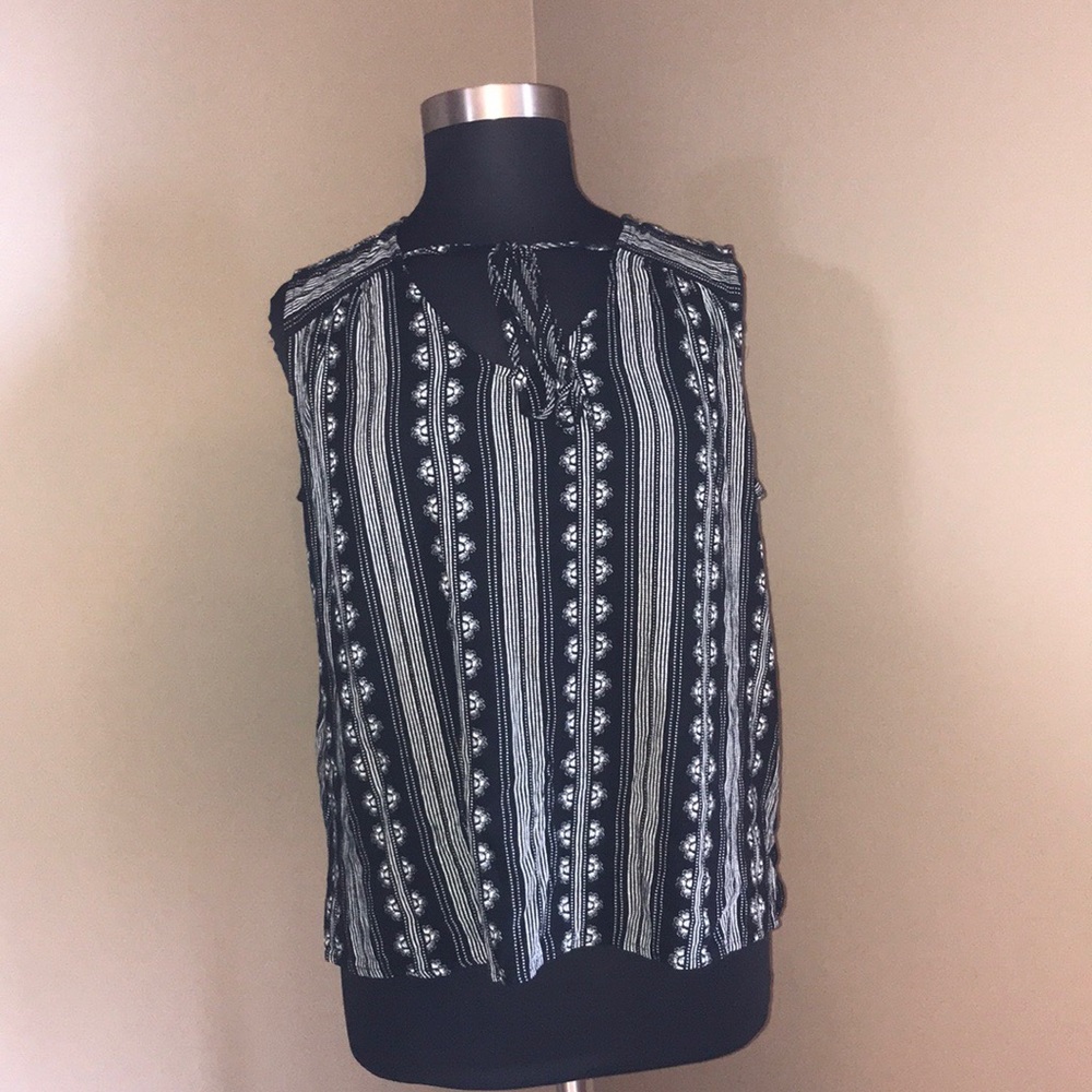 This Sleeveless Black and White Blouse
